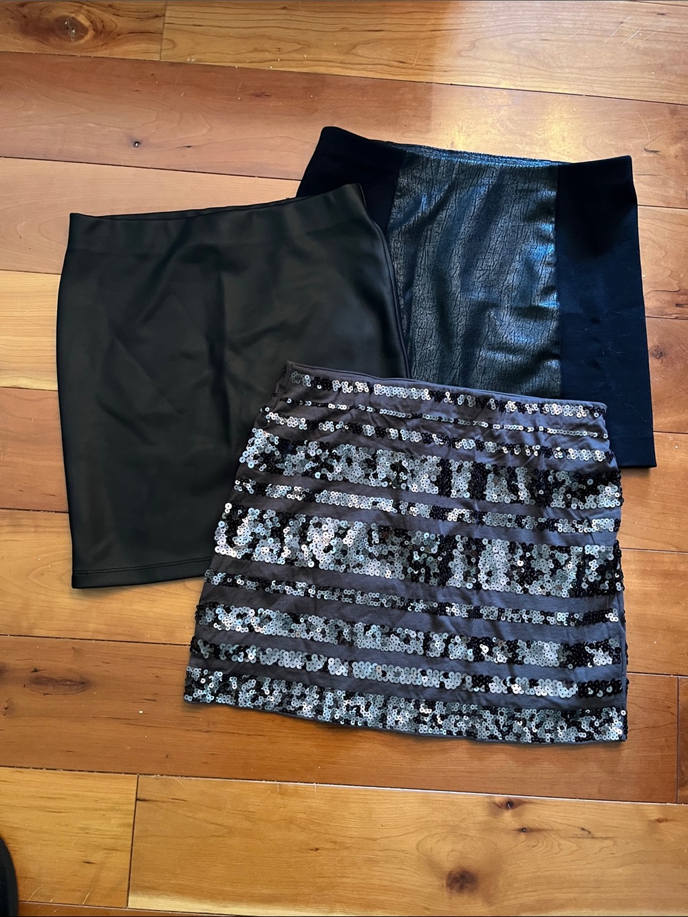 Express set of three pull on mini skirts.